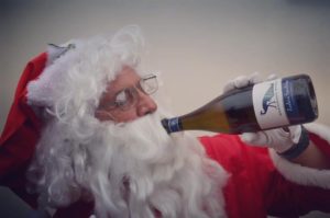 Santa drinking a bottle of Woodsoak Wines Zaahira Sparkling