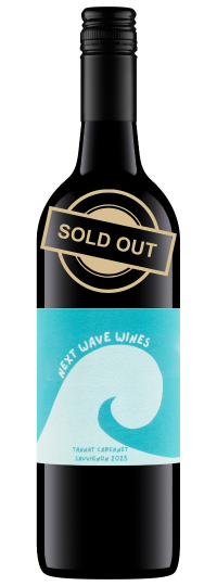 A bottle of Next Wave Tannat Cabernet Sauvignon with a blue label and gold Sold Out label